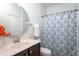 A full bathroom features a vanity sink, toilet and tub-shower combo at 453 Granite Saddle Dr, Rolesville, NC 27571
