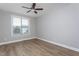 This bedroom has a ceiling fan, wood flooring and lots of light at 453 Granite Saddle Dr, Rolesville, NC 27571