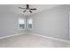 A bedroom with neutral walls has plenty of natural light and ceiling fan at 453 Granite Saddle Dr, Rolesville, NC 27571