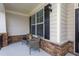 Welcoming front porch featuring decorative stone and seating, perfect for enjoying neighborhood views at 453 Granite Saddle Dr, Rolesville, NC 27571