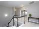 Open hallway leading to various rooms, with a view of a bright office and a staircase with white railings at 453 Granite Saddle Dr, Rolesville, NC 27571