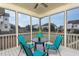 Cozy screened-in porch with seating area, perfect for outdoor relaxation and entertaining guests at 453 Granite Saddle Dr, Rolesville, NC 27571