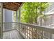 This balcony overlooks some green trees and features a wood lattice design at 4631 Timbermill Ct # 203, Raleigh, NC 27612