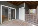This balcony has a sliding glass door, a door, a wood lattice and wood floor at 4631 Timbermill Ct # 203, Raleigh, NC 27612