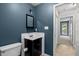 Bathroom with a vanity and a view to the hallway at 4631 Timbermill Ct # 203, Raleigh, NC 27612