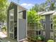 Gray condo with wood fence and exterior stairwell at 4631 Timbermill Ct # 203, Raleigh, NC 27612
