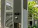Exterior building with multiple apartment units and white trellis accents at 4631 Timbermill Ct # 203, Raleigh, NC 27612