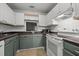 Functional kitchen with white appliances, white subway tile, and two-tone cabinets at 4631 Timbermill Ct # 203, Raleigh, NC 27612