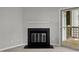 Cozy living room features a fireplace and access to an outdoor deck at 4631 Timbermill Ct # 203, Raleigh, NC 27612