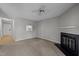 Spacious living room with fireplace, neutral carpet, and views to the kitchen at 4631 Timbermill Ct # 203, Raleigh, NC 27612
