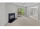 Cozy living room with a fireplace and sliding glass doors to the outside deck at 4631 Timbermill Ct # 203, Raleigh, NC 27612