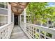External corridor with a white lattice railing to the side at 4631 Timbermill Ct # 203, Raleigh, NC 27612