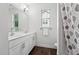 Bright bathroom with double vanity, modern fixtures, and hard wood floors at 475 Long View Dr, Franklinton, NC 27525