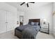 Neutral-toned bedroom featuring carpet, ceiling fan, and modern decor at 475 Long View Dr, Franklinton, NC 27525