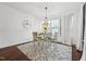 Bright dining area features hardwood floors, patterned rug, modern light fixture and ample natural light at 475 Long View Dr, Franklinton, NC 27525