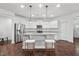 Bright kitchen features stainless steel appliances, granite countertops, and an island with bar seating at 475 Long View Dr, Franklinton, NC 27525