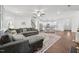 Open-concept living area flows to the kitchen, complete with a plush sectional sofa and stylish decor at 475 Long View Dr, Franklinton, NC 27525