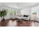Bright living room with white walls, wood floors, a large windows and comfortable seating at 475 Long View Dr, Franklinton, NC 27525