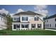 Charming two-story home featuring a blend of siding and brick, complemented by dark shutters and a well-manicured lawn at 50 Guardian St, Youngsville, NC 27596