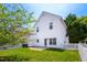 Two-story white house featuring a well-maintained lawn and white picket fence at 5016 Dawn Piper Dr, Raleigh, NC 27613