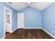 Bedroom featuring wood flooring, walk-in closet, and an ensuite bathroom at 5016 Dawn Piper Dr, Raleigh, NC 27613