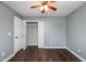 Spacious bedroom with closet, ceiling fan, and hardwood floors at 5016 Dawn Piper Dr, Raleigh, NC 27613