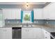 Bright kitchen features granite countertops, stainless steel appliances, and a window view at 5016 Dawn Piper Dr, Raleigh, NC 27613