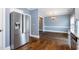 This spacious kitchen features stainless steel appliances, granite countertops, and wood flooring at 5016 Dawn Piper Dr, Raleigh, NC 27613