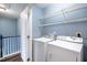 Functional laundry area equipped with modern washer and dryer units, and convenient shelving at 5016 Dawn Piper Dr, Raleigh, NC 27613
