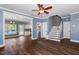 Spacious living room with hardwood floors, crown molding, and staircase leading up to the second story at 5016 Dawn Piper Dr, Raleigh, NC 27613
