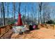 Lovely back deck features a table, chairs, grill and railings providing an excellent space to entertain outdoors at 511 Windstream Way, Cary, NC 27518