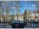 Backyard view of home in winter from deck with grill at 511 Windstream Way, Cary, NC 27518