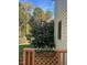Inviting backyard deck featuring a planter box with colorful blooms and lush greenery, creating a serene view at 511 Windstream Way, Cary, NC 27518