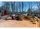 Spacious wooden deck perfect for outdoor dining and entertaining, with a table, chairs, and grill at 511 Windstream Way, Cary, NC 27518