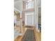 Grand foyer featuring hardwood floors, a high ceiling, and an elegant staircase at 511 Windstream Way, Cary, NC 27518
