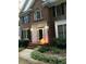 Brick home with well-kept landscaping and a decorative pumpkin near the entrance at 511 Windstream Way, Cary, NC 27518