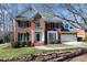 Beautiful two-story brick home with manicured landscaping and inviting entrance at 511 Windstream Way, Cary, NC 27518