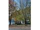 Charming front exterior with lush landscaping and mature trees in the front yard at 511 Windstream Way, Cary, NC 27518
