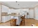 Modern kitchen featuring white cabinetry, granite countertops, and stainless steel appliances at 511 Windstream Way, Cary, NC 27518
