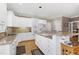 Bright kitchen with white cabinets, granite countertops, and a breakfast bar at 511 Windstream Way, Cary, NC 27518
