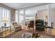 Spacious living room with hardwood floors, columns, and a view into the kitchen at 511 Windstream Way, Cary, NC 27518