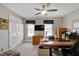 Office with a ceiling fan, two windows, a large desk, and carpeted floors at 511 Windstream Way, Cary, NC 27518