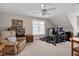 Recreation room with a ceiling fan, one window, exercise equipment, and carpeted floors at 511 Windstream Way, Cary, NC 27518