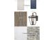 Close-up of the interior, showcasing cabinetry, LVP flooring, countertops, and exterior lighting fixture at 516 Hillard Ln, Wendell, NC 27591