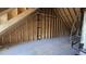 Spacious attic interior featuring wood framing, offering a glimpse into the structural integrity of the home at 55 Livingston Ln, Spring Hope, NC 27882