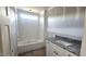 The new bathroom features a tub with white subway tiles and a stylish vanity with gray granite countertop at 55 Livingston Ln, Spring Hope, NC 27882