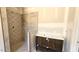 Bathroom featuring a tiled shower and a vanity with a sink, designed with attention to detail at 55 Livingston Ln, Spring Hope, NC 27882