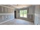This unfinished bedroom features ample natural light and is ready to be transformed into a personal space at 55 Livingston Ln, Spring Hope, NC 27882