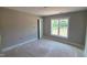 Bedroom featuring a modern window with trim, and neutral paint, offering a bright space at 55 Livingston Ln, Spring Hope, NC 27882