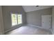 Bedroom featuring a modern window with trim and neutral paint at 55 Livingston Ln, Spring Hope, NC 27882